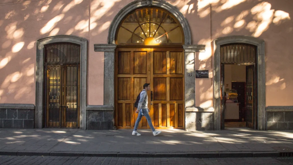 traveler walking slowly through a historic street observing daily life