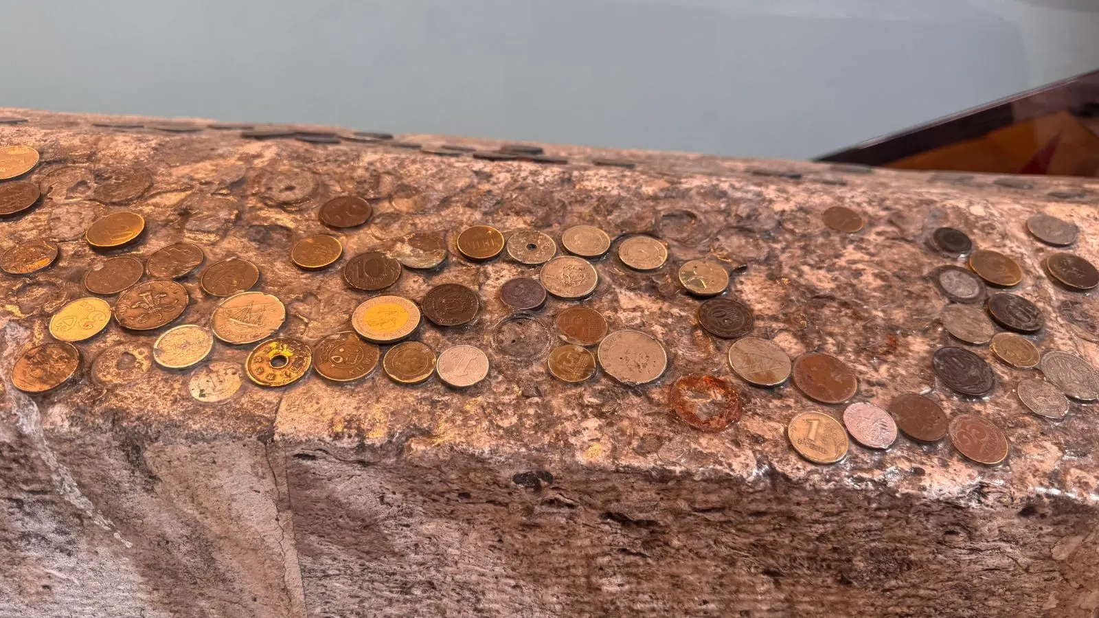 Coins glued on the top of a fence in Sultanahmet, Istanbul.